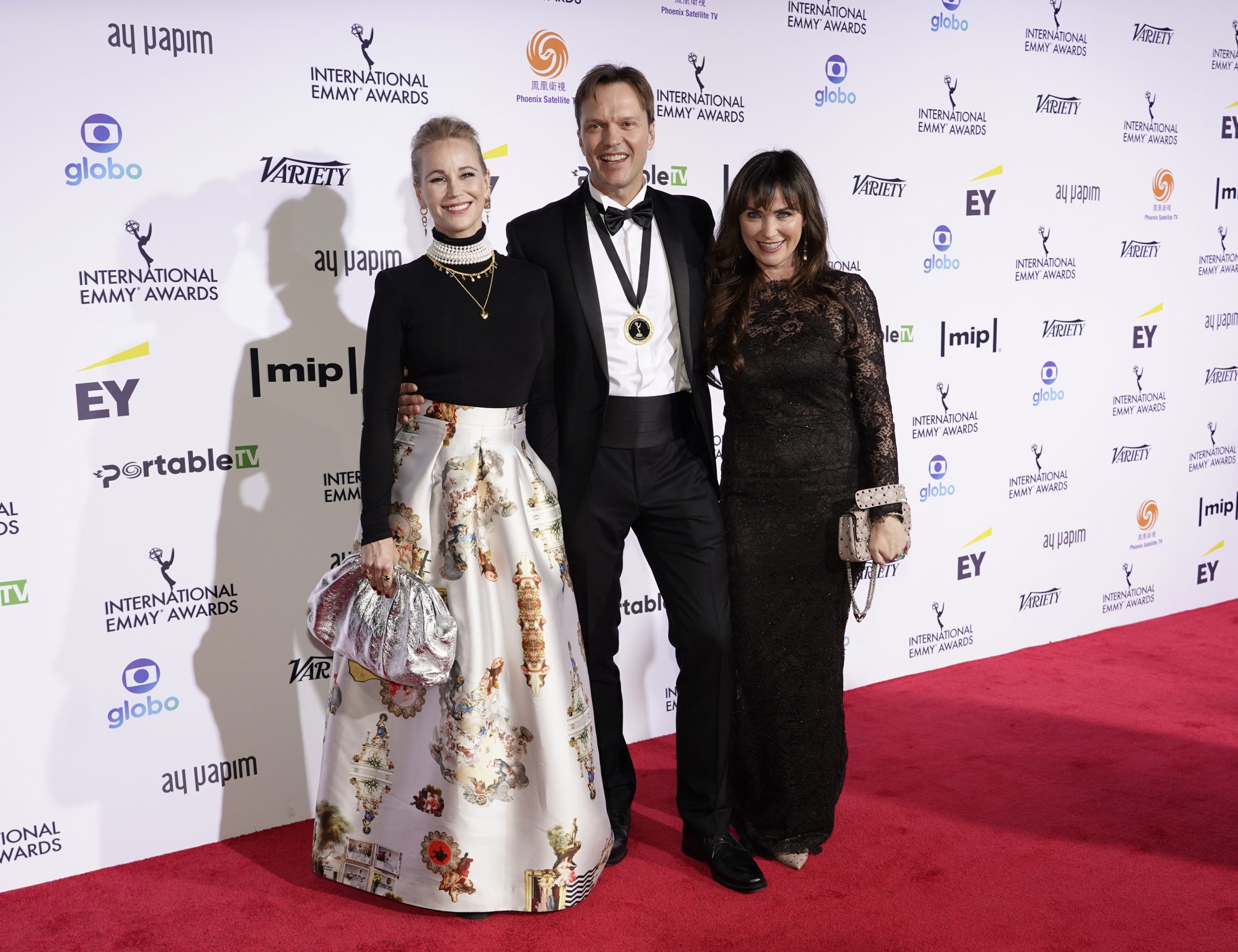 Drama Series Nominees for Atlantic Crossing, Alexander Eik and Silje Hopland Eik with Sofia Helin on the red carpet at the 49th International Emmy Awards, November 22, 2021 in New York City. 49th International Emmy Awards